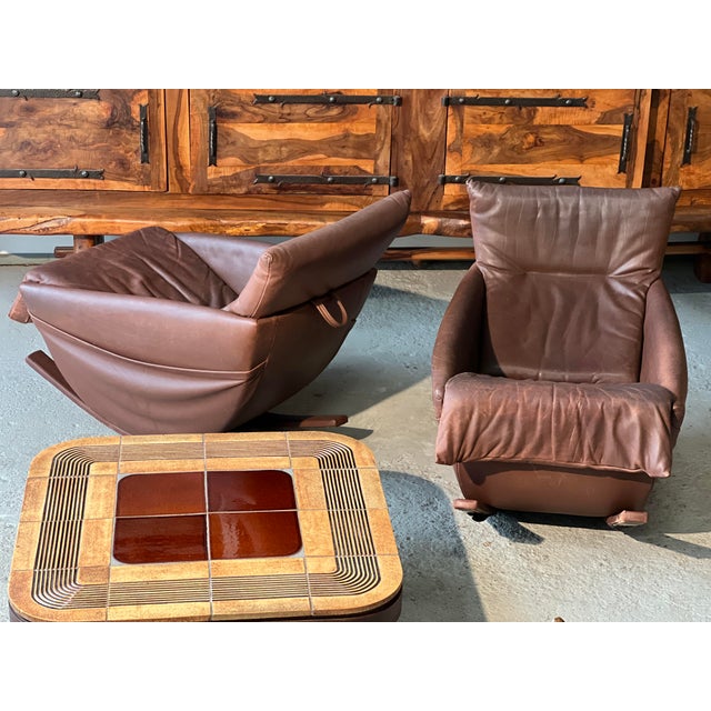 Pair of De Sede rocking chairs, Switzerland, 1970, in brown leather. Beautiful patina. No tears or snags. Leather-covered...