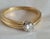 A fine vintage 18ct yellow gold solitaire ring dating to 1994, featuring a classic and timeless single-diamond design. The...