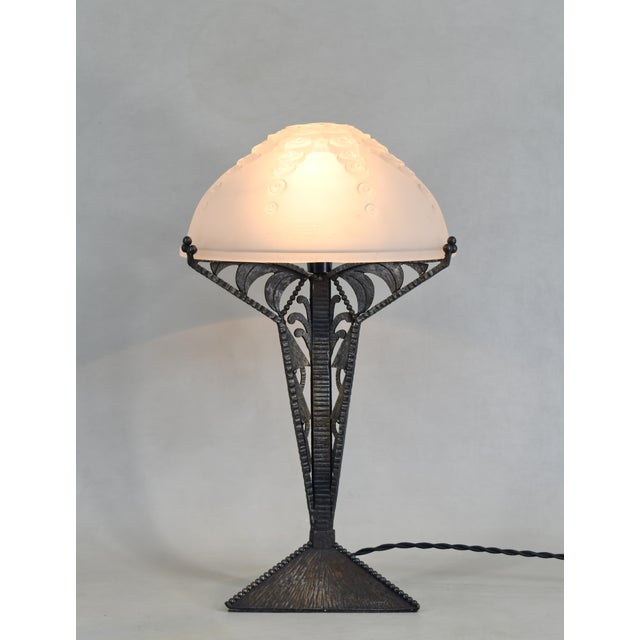 Augustin Calmels & Muller frères A French 1925-1935 art deco lamp in wrought iron. It was made by Augustin Louis Calmels...