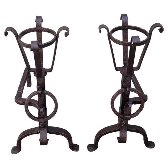 Pair of 19Thc cast Iron fire place andirons. Each andiron measures 25 long x 25 high x 12 wide.This pair of andirons are...
