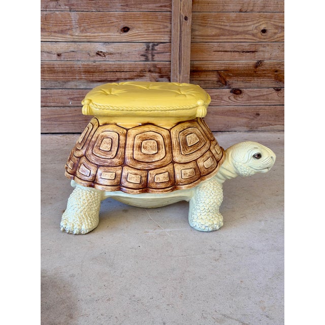 A whimsical tortoise accent table with plenty of personality, crafted from heavy cast resin. His richly patterned brown...