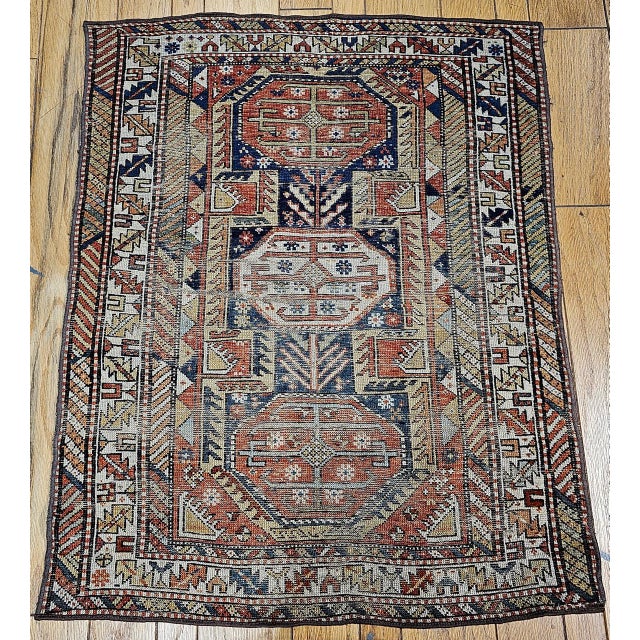 A beautiful Caucasian Shirvan rug from the southern Azerbaijan region of the Caucasus, featuring a striking geometric...