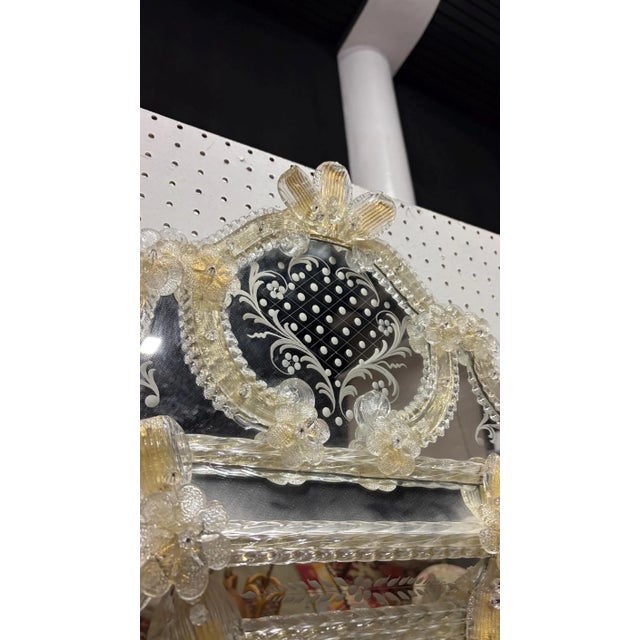 This is an exquisite authentic Murano mirror. It is labelled Murano bottom front. It has beautiful gold glass flowers and...