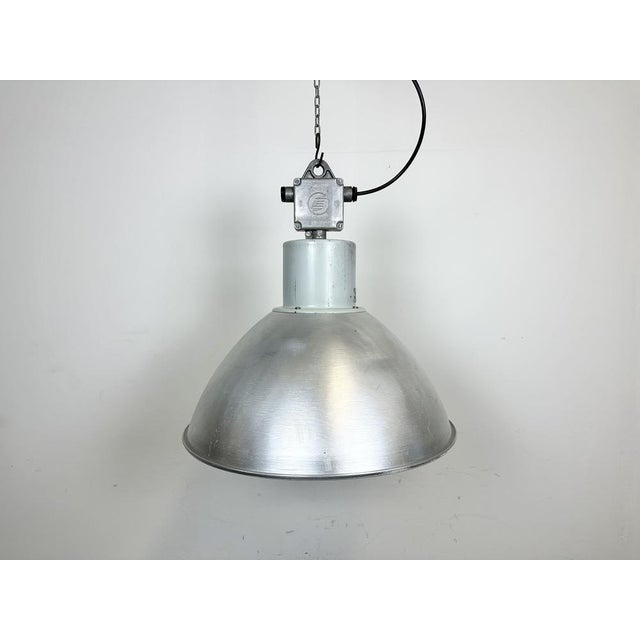This pendant lamp was made by Elektrosvit and originally used in a factories in former Czechoslovakia in the 1960s. The...