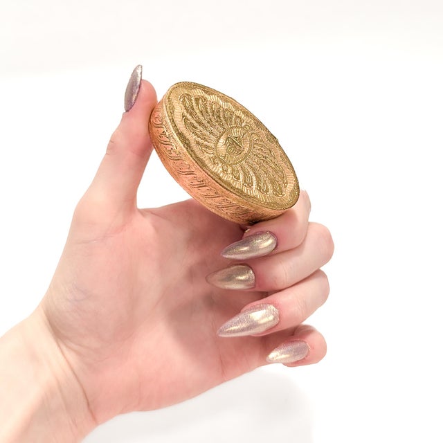 An historically important gilt bronze snuff box. With highly detailed Neoclassical engraving throughout to the lid and...