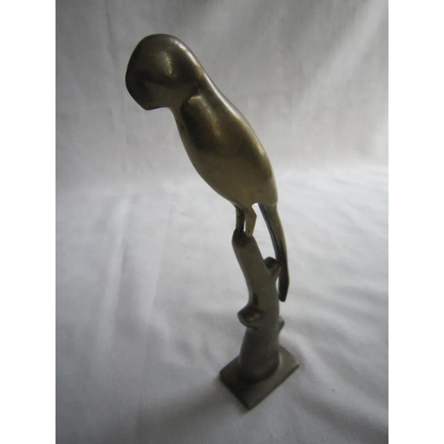 Heavy brass figure of a parrot in Art Deco style. It measures 12"H x 2"W 'x 2.75"D and is excellent condition. I have not...