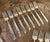 This 55 piece silver plate flatware service includes 16 teaspoons measuring 6 inches long by 1.125 inches wide, 8 soup...