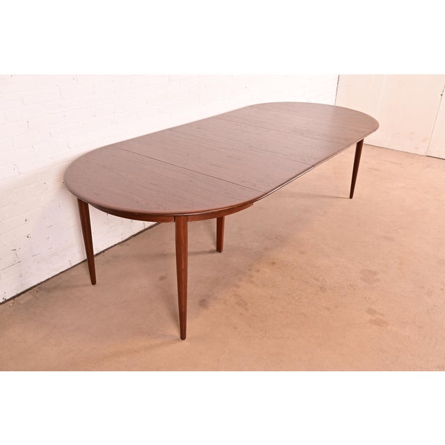 An exceptional mid-century Danish Modern teak extension dining table By Skovmand & Andersen for Moreddi Denmark, Circa...