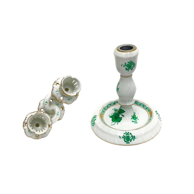A charming porcelain candlestick from the mid-20th century by Herend, Hungary, featuring the iconic Apponyi pattern in...