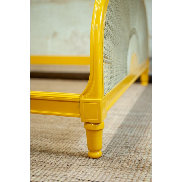 Yellow Lacquered Wooden Bed with Vienna Straw Bed made of glossy yellow lacquered wood, featuring an arched headboard and...