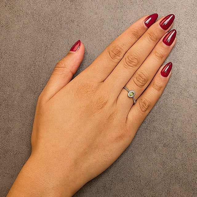 Elegant and radiant, this exquisite ring is a symphony of color and light, masterfully crafted from rhodium-plated 10K...