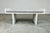 An attractive mid-century modern minimalist entryway or window bench having white laminate frame over solid wood with...