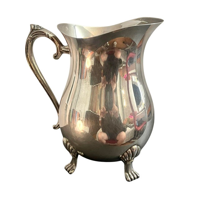 This elegant vintage silver-plated water pitcher by Leonard Silver captures a timeless, traditional aesthetic. Dating to...