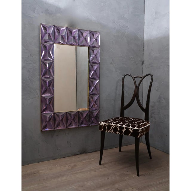 A strong violet frame reach the eye of the beholder leaving him entranced; of Murano violet art glass wall mirror. The...