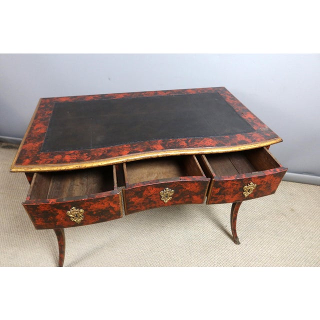 A Louis XV style lacquered desk with a gently curved top. The lacquer has been restored. Dating from the late 18th or...