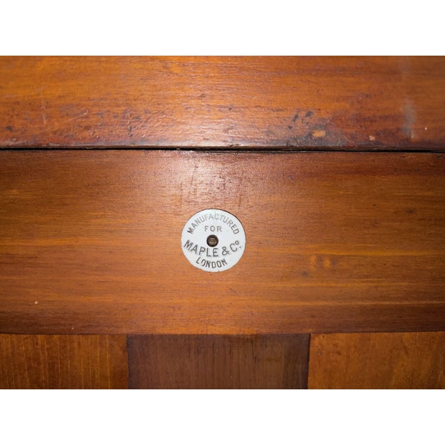 A lovely late Victorian period satinwood display cabinet by Maple & Co. of London. Of excellent construction in solid...