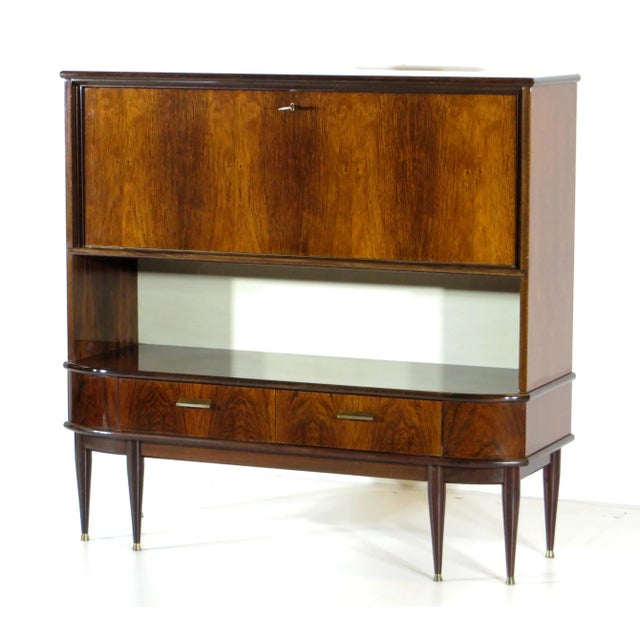 Vintage mid century Art Deco secretary bar cabinet sideboard in rosewood from the 1920s-30s. This sideboard cabinet has...