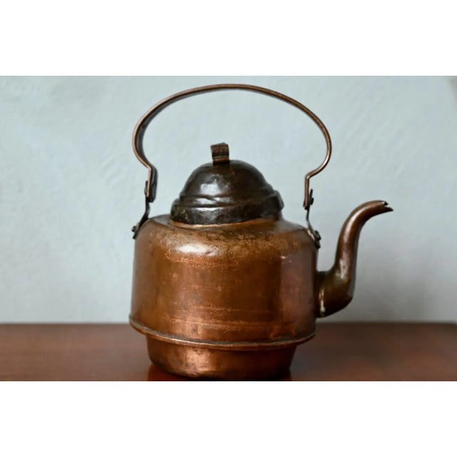 Partners of “Fika”, these famous Swedish relaxing and convivial breaks, this charming “Tekanna” copper teapot dates from...