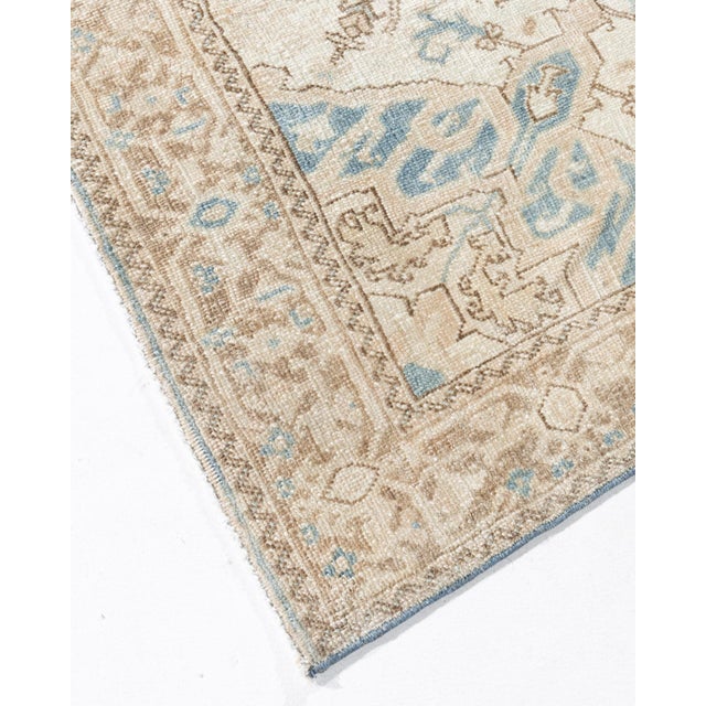 A beautiful hand-knotted rug, traditionally crafted by skilled artisans using fine-quality wool. The hand-knotted...