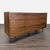 This Crate & Barrel dresser features a sleek mid-century modern design with a beautiful walnut finish. It includes nine...