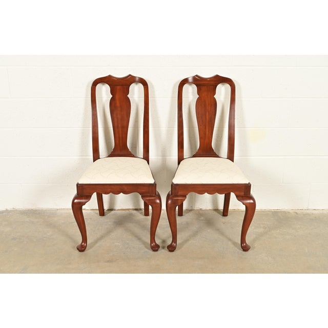 An outstanding pair of Queen Anne or Georgian style side chairs or dining chairs By Henkel Harris USA, Circa 1970s Solid...