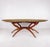 A mid-century modern brass tray table featuring a scalloped solid brass tray top with intricate hand-etched detailing and...
