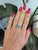 A Sleeping Beauty turquoise in a clean, robin's-egg blue is set east-west at the centre of this solid 14K yellow gold...