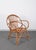 Amazing midcentury Rattan shell armchair. This piece was produced in Italy in the 1950s and is attributed to the mastery...