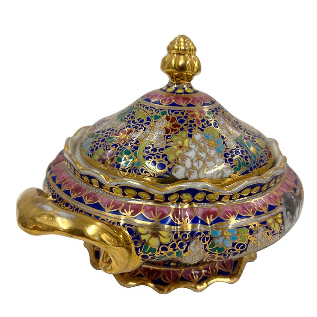 This is a Thai Benjarong porcelain soup tureen. This type of ware is a traditional Thai craft known for its intricate,...