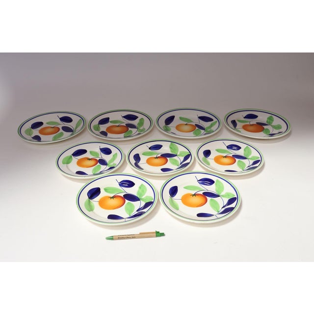Set of nine porcelain plates (four dinner/five salad) with hand-painted orange vine motif by Richard Ginori (ca. 1950s,...