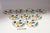 Set of nine porcelain plates (four dinner/five salad) with hand-painted orange vine motif by Richard Ginori (ca. 1950s,...