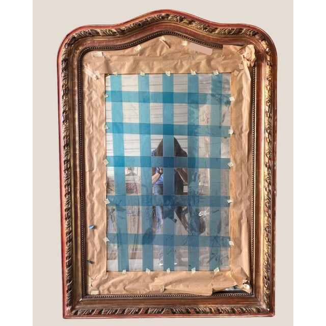 Antique Louis Philippe giltwood mirror with an early 20th-century French mirror plate stamped 1933. Beautiful 19th-century...