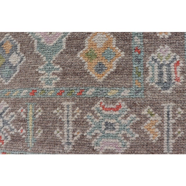 Textile Small Turkish Oushak Rug With Soft Brown Ground and Geometric Pastel Motifs For Sale - Image 7 of 10