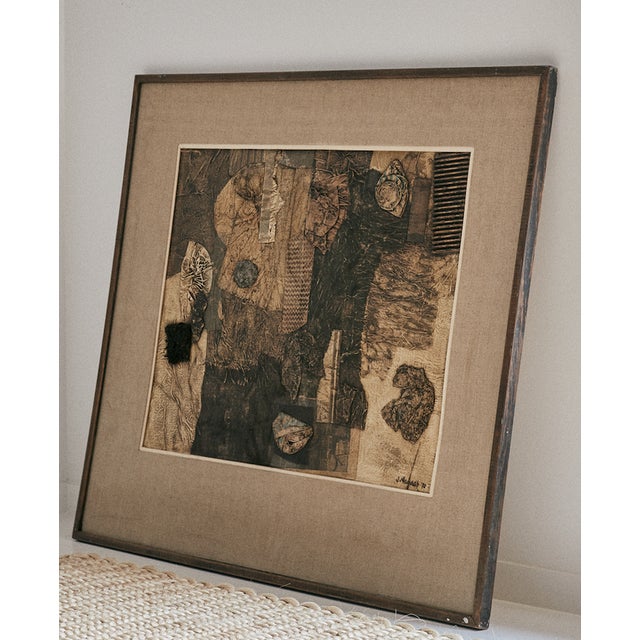 Large scale abstract piece of wall art in wood frame with linen matte, circa 1970 by James Thomas. Neutral but full of...