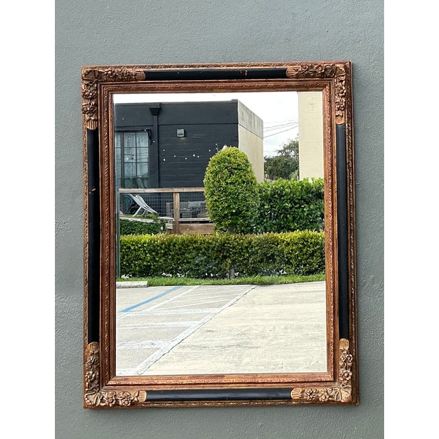 This vintage ornate wall mirror showcases a sophisticated blend of classical elegance and enduring craftsmanship. Crafted...