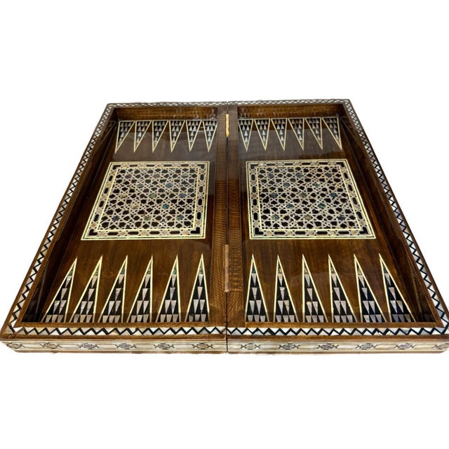 Experience the beauty of traditional craftsmanship with this handmade wooden backgammon and chess board, carefully created...