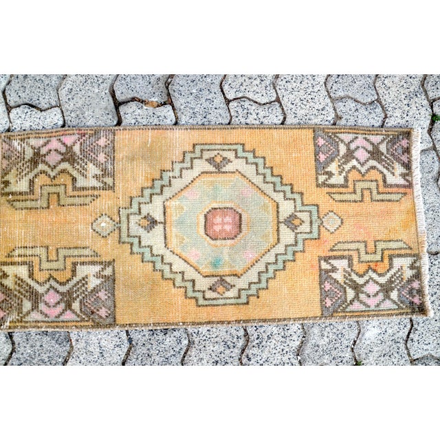 This is a vintage Turkish Oushak rug from the 1960s. The piece was hand-knotted.