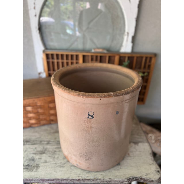 This antique 8-gallon stoneware crock exudes rustic charm, perfect for farmhouse-inspired spaces. Its sturdy build and...