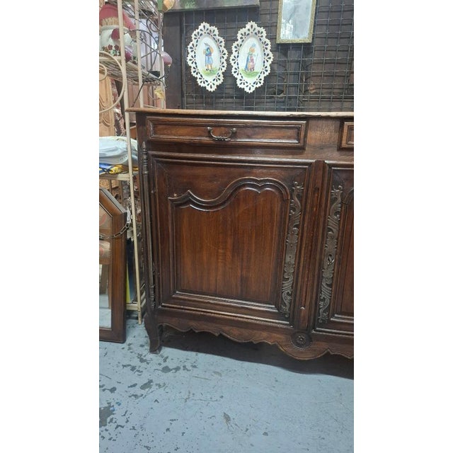 A low, solid oak sideboard from the late 19th century with two drawers and one shelf. The lock and key are functional....