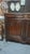 A low, solid oak sideboard from the late 19th century with two drawers and one shelf. The lock and key are functional....