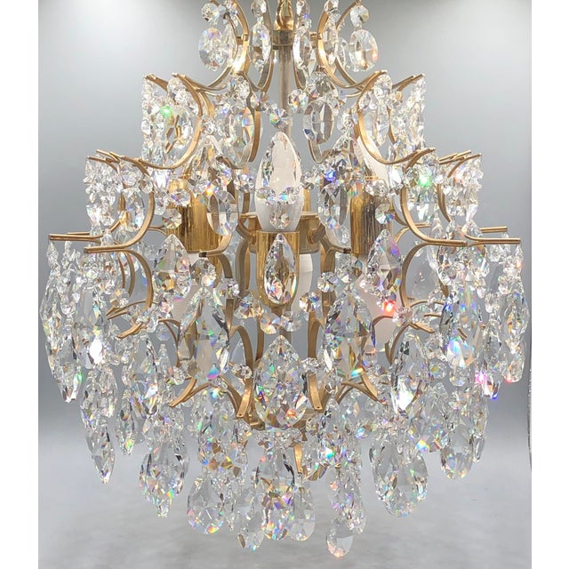 This magnificent vintage crystal chandelier from Italy is a truly stunning example of elegant lighting art. Manufactured...