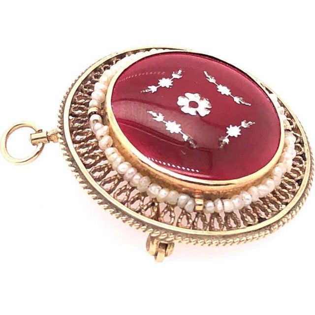 14 Karat Contemporary Brooch and Pendant with Pearls. 64 piece round pearls. 8 grams total weight.