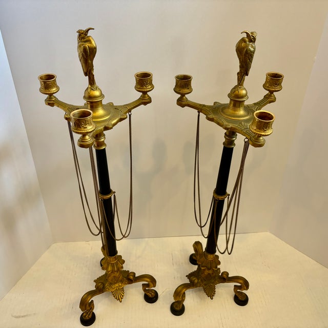 A magnificent pair of 19Th Century French Neo Greco candelabra attributed to the Barbedienne foundry , crafted from...