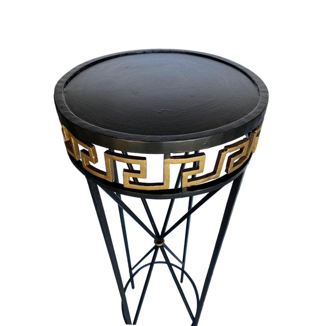 This striking pair of tall metal pedestals brings a bold and elegant presence to any space, making them ideal for...