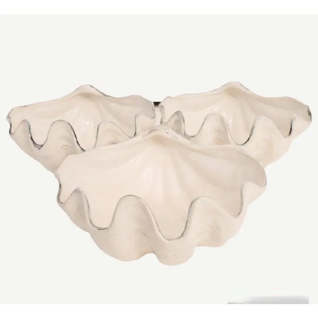 A set of 3 ceramic clam shell serving bowls by pottery barn The bowls are great for side dishes or condiments. they're...