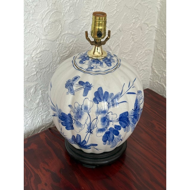 This table lamp is made from a ribbed melon form ginger jar in crisp blue and white porcelain. Flowering branches and...