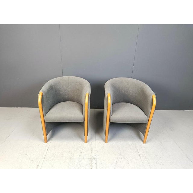 Vintage pair of elegant armchairs in the style of Giorgetti furniture. Made from grey fabric and bentwood armrests and...