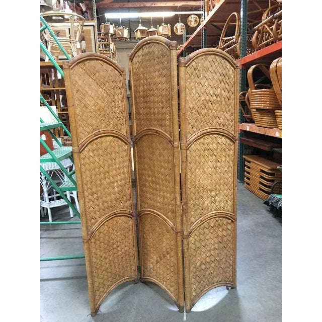 Original 1950 Woven Wicker room divider folding screen with an arched top. This rattan and woven wicker folding room...