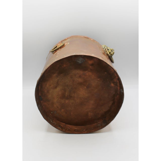 Late 19th century covered copper bucket or coal hod, English. Suited to many uses. Entwined loop cover handle. Brass lion...