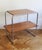 The table's construction recalls breuer's iconic b12 and b22 models produced by thonet. Like those celebrated designs, it...